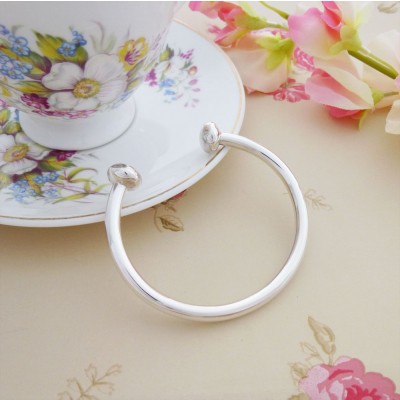 Rebecca silver ladies torque bangle bracelet in a small size, solid silver available to buy online in the UK Rebecca silver ladies torque bangle bracelet in a small size, solid silver available to buy online in the UK