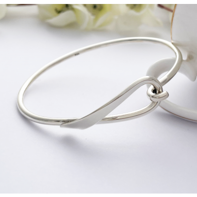 Lyra Loop Silver Bangle with a hook and a loop connector Lyra Loop Silver Bangle with a hook and a loop connector