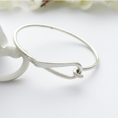 Lyra Loop Silver Bangle with a hook and a loop connector