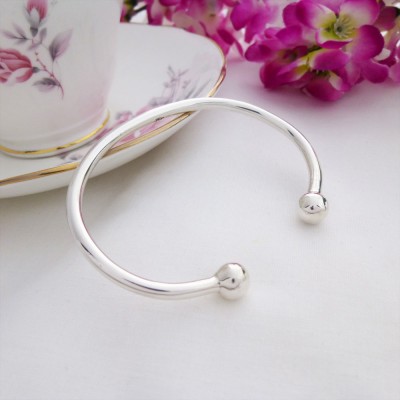 ladies 925 sterling silver torque bangle with ball ends from Guilty