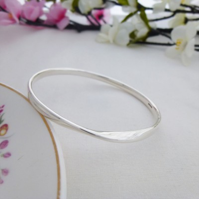 Trixie Large size bangle for larger wrist with a single twist made in the UK Trixie Large size bangle for larger wrist with a single twist made in the UK