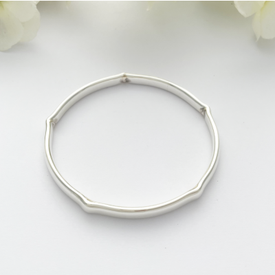 Indie Solid Silver Bangle with five crimps for a unique look Indie Solid Silver Bangle with five crimps for a unique look