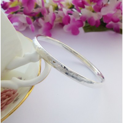 Edie large sized hand hammered solid silver bangle for women with large wrists in the UK Edie large sized hand hammered solid silver bangle for women with large wrists in the UK