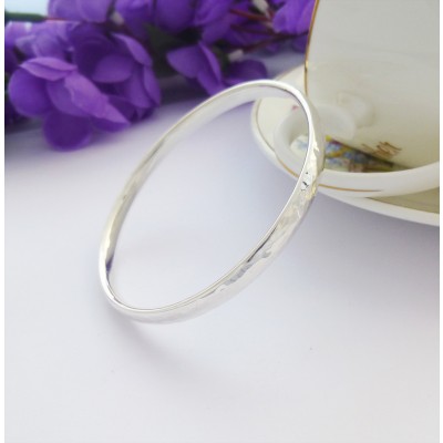 Edie large sized hand hammered solid silver bangle for women with large wrists in the UK Edie large sized hand hammered solid silver bangle for women with large wrists in the UK