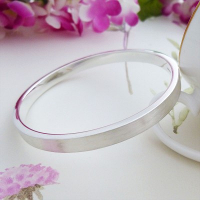 Elsa engraved personalised brushed exterior silver bangle from Guilty