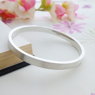 Elsa small size silver bangle bracelet online in the UK with frosted exterior