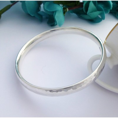 Kelly hand hammered silver bangle for small knuckles and wrists, handmade in the UK