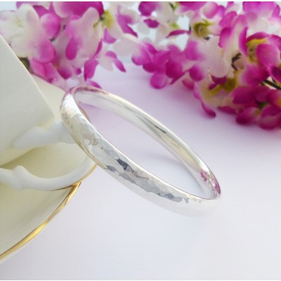 Kelly hand hammered silver bangle for small knuckles and wrists, handmade in the UK