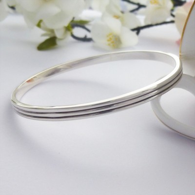 Phoebe large sterling silver bangle personalised interior and two grooves around the outside Phoebe large sterling silver bangle personalised interior and two grooves around the outside