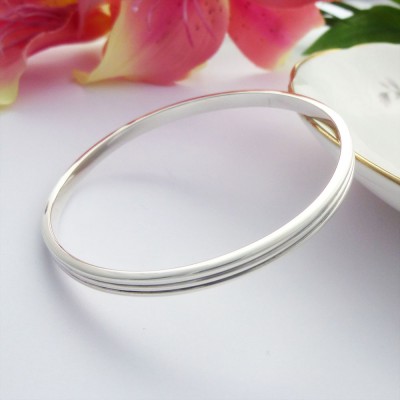 Phoebe large sterling silver bangle personalised interior and two grooves around the outside Phoebe large sterling silver bangle personalised interior and two grooves around the outside