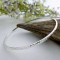 Hammered effect exterior slave bangle