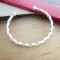 Funky twisted solid silver bangle