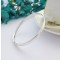 Edie silver bangle with an oval shaped cross section