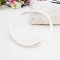 Isabeau round cross section bangle which is solid silver