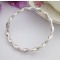 Twisted design silver bangle