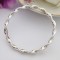 Tia curved and highly polished silver bangle Tia curved and highly polished silver bangle