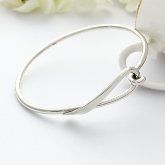 Lyra Loop Silver Bangle with a hook and a loop connector