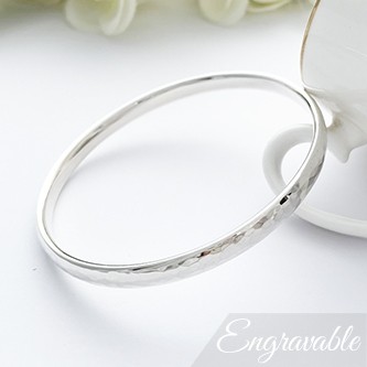 Ladies hand hammered bangle in small size, solid silver