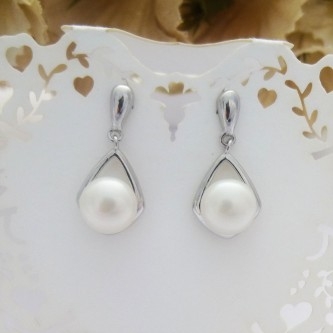 bridal freshwater pearl earrings with a sterling silver swirl